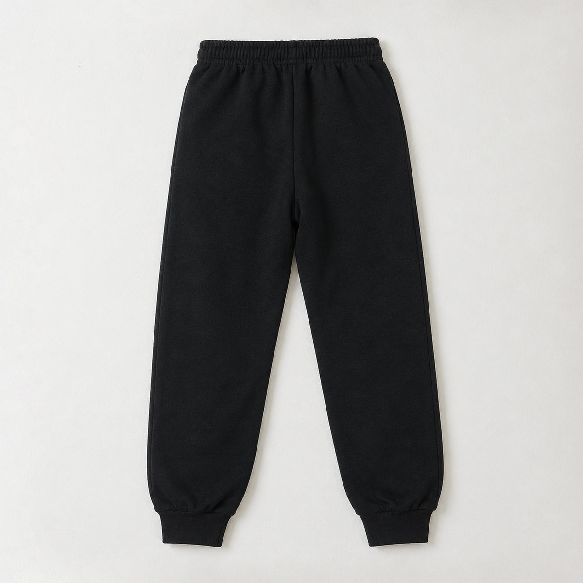 Full-length black fleece joggers for kids with grey contrast panels, a comfortable drawstring waist, and ribbed ankle cuffs.