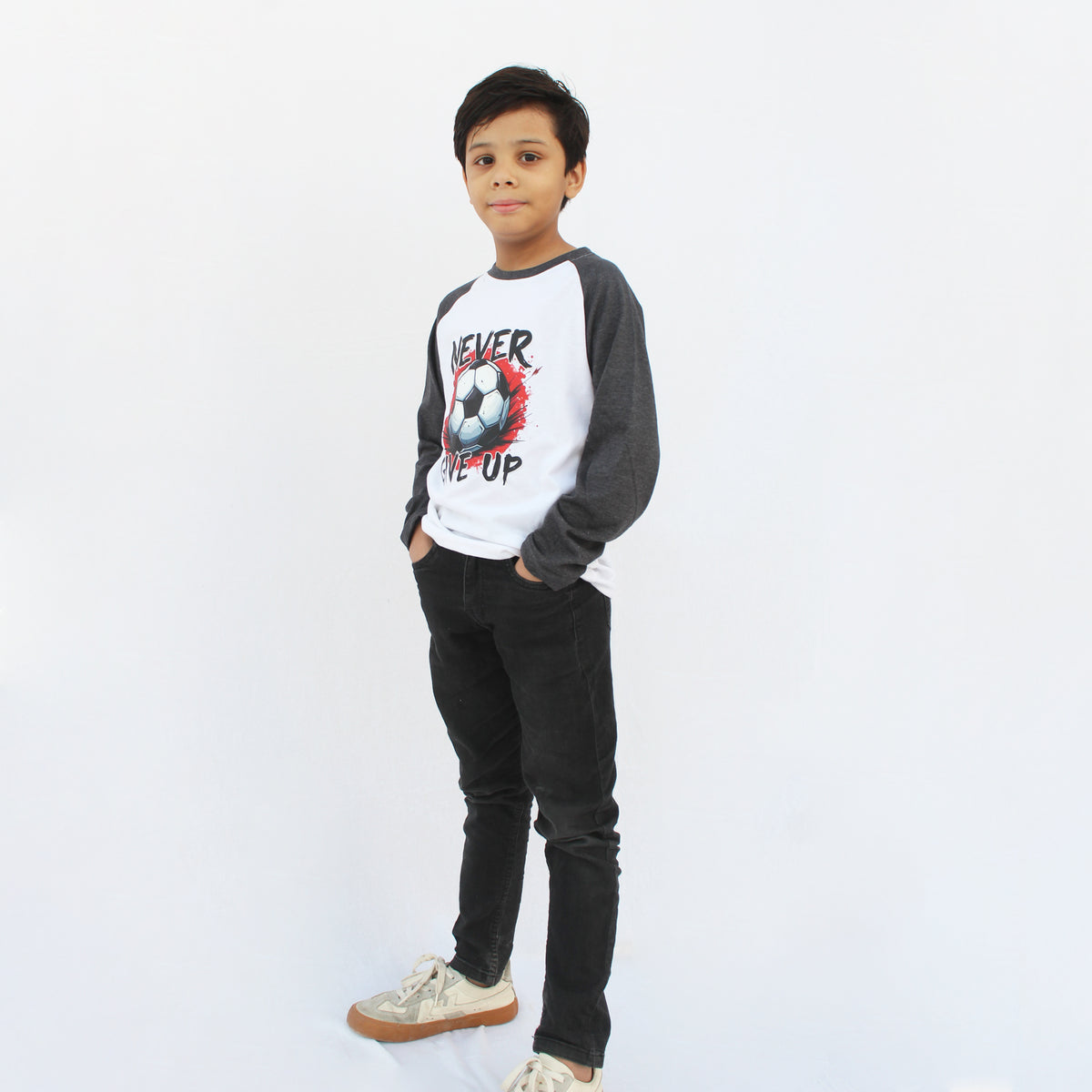 Close-up of charcoal raglan sleeves and neckline on a white full sleeve T-shirt.
